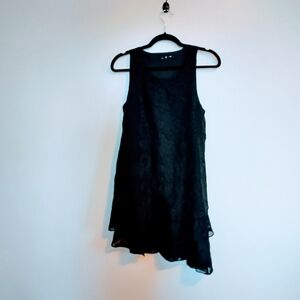 Gianni Bini little black dress, lined with floral print, sleeves asymmetric hem